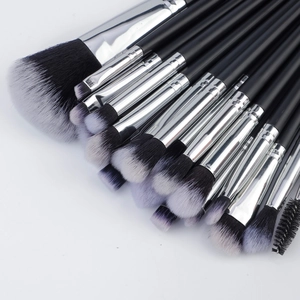 Close-up of 20pcs professional makeup brushes with soft tricolor synthetic bristles