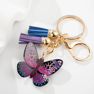 Colorful butterfly pendant keychain with blue and purple tassels in gold finish