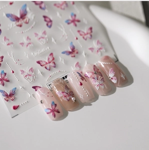 Macro view of 5D butterfly nail stickers with 3D embossed texture and gradient colors