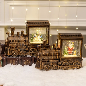 Vintage bronze Christmas train snow globe with Santa and snowman on white faux snow