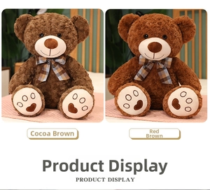Detail of plush teddy bears in cocoa and red brown with embroidered heart paws and bows