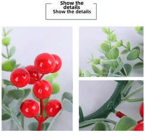 Detailed macro view showing glossy red Christmas berries and artificial green eucalyptus leaves