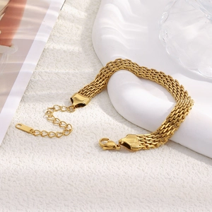 Detail of 18K gold plated stainless steel mesh strap bracelet with lobster clasp