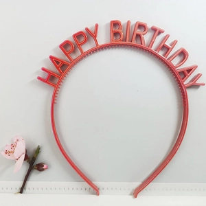 Detail shot of a red Happy Birthday plastic headband with 3D letters for party celebration