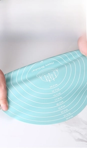 Flexible blue silicone pastry mat with round measurement scales and tear-resistant texture