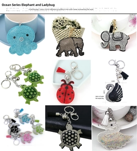 Detailed view of rhinestone animal keychains with colorful tassels and metallic finish