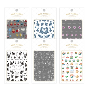 Set of six 3D minimalist nail art stickers with various patterns in branded packaging