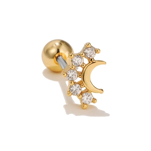 Detail of gold crescent moon and zircon star cartilage stud with screw ball back