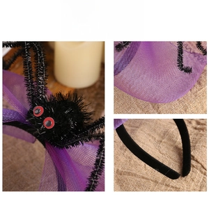 Detail showing the black plush spider and purple mesh net on a Halloween party headband
