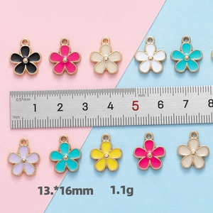 Detailed view of 13x16mm alloy flower charms with ruler measurement for DIY crafts