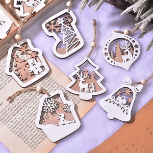 Double-layered laser-cut wooden Christmas ornaments with reindeer and snowflake patterns