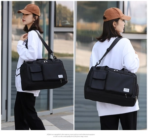 Detail of multi-functional black gym bag showing side shoe compartment and nylon fabric