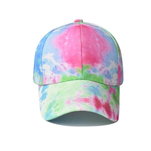 Macro detail of pink, blue, and green tie-dye pattern on cotton sun visor baseball cap