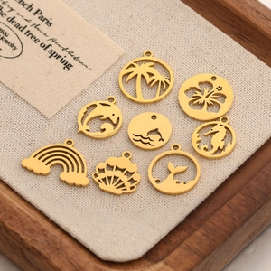 Set of 8 gold stainless steel ocean pendants with coconut tree and dolphin designs