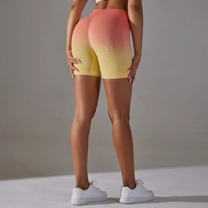 Rear view of high-waisted seamless biker shorts with orange to yellow gradient effect