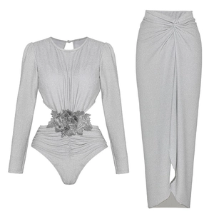Detail of silver metallic long-sleeve bodysuit with 3D floral applique and cutout waist