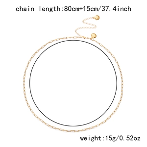 Detail of gold metal shell pendant and dainty chain waist link measuring 80cm plus 15cm