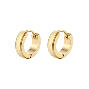 Close-up of golden hoop earrings featuring brushed metal texture and snap closure