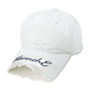 Detail of white distressed baseball cap with blue script embroidery on the brim