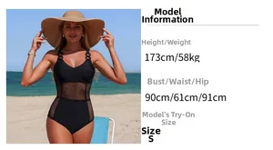 Detail view of black one-piece swimsuit with mesh panels and buckled straps for women