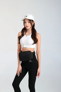 Detail of a black nylon sports waist bag with adjustable strap and smooth metal zipper