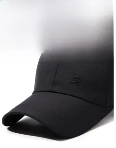 Close-up of black cotton twill baseball cap with Sport embroidery and reinforced brim