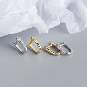 Macro view of S925 sterling silver U-shaped earrings with colorful zircon and 925 hallmark