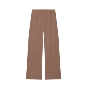 Close-up of brown ribbed knit texture on soft V-neck high-waist wide-leg pants