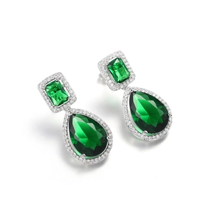 Detail view of pear-cut emerald zircon earrings with silver halo and micro-inlaid stones