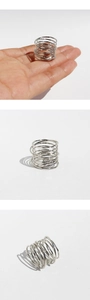 Three-view detail of silver multi-layer spiral ring showing fit and structure