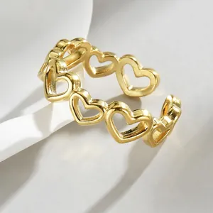 Polished golden stainless steel open ring with hollow heart patterns for women