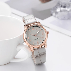 Elegant women's quartz watch with gray leather strap and rose gold minimalist dial case