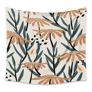Detail of bohemian tapestry featuring abstract brown flowers and teal leaves on beige