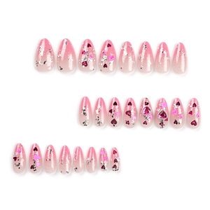 Pink gradient press-on nails set with silver glitter and pink heart gemstone charms