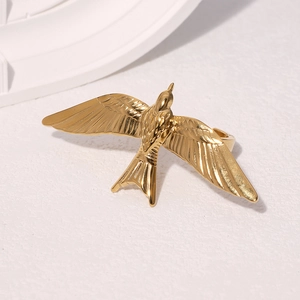 Golden flying bird stainless steel open ring with a detailed swallow wings design