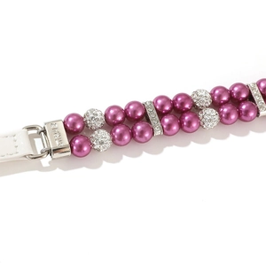 Close-up of double-row purple pearl pet collar with sparkling rhinestone balls