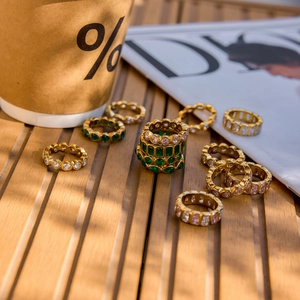 Macro shot of 18k gold plated stainless steel rings with colorful zircon gemstones