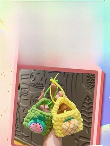 Close-up of handmade crochet dragon fruit and pineapple mini coin purses with carrying loops