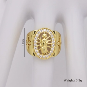 Macro detail of a 18mm religious ring featuring a golden saint relief and side crosses
