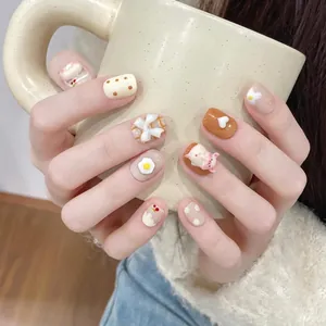 Handmade press-on nails with 3D cute pig, heart and bow designs in warm beige and brown