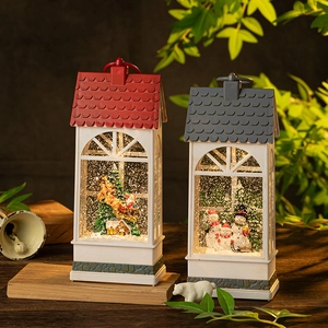 Christmas musical snow globe lanterns with Santa and snowman scenes on wooden bases