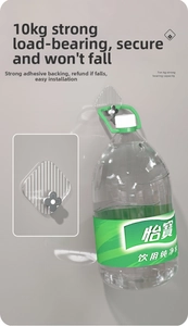 Close-up of a silver flower wall hook holding a heavy water bottle to show strength