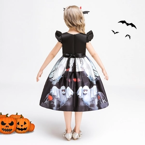 Detail of girls' Halloween pumpkin dress with silk finish and back bow tie