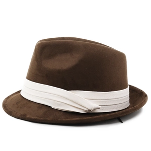 Detail of brown fedora felt hat showing thick wool texture and white fabric band