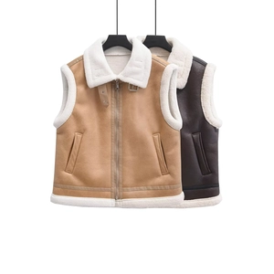 Detail of faux suede vest with plush shearling lining, zipper and metal buckle collar