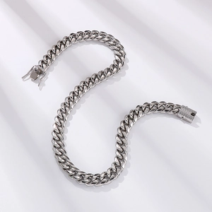 12mm silver punk hip-hop Cuban link necklace with CNC set rhinestones on a white surface