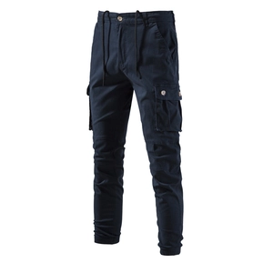 Detail view of navy cargo pants featuring large side pockets and drawstring waist