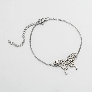 Detail of silver stainless steel chain bracelet with a hollow butterfly pendant and clasp
