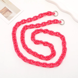 Close-up of bright pink acrylic crossbody chain strap with silver spring rings