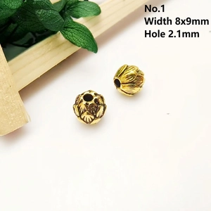 Macro detail of antique gold lotus beads with dimensions 8x9mm and 2.1mm hole size